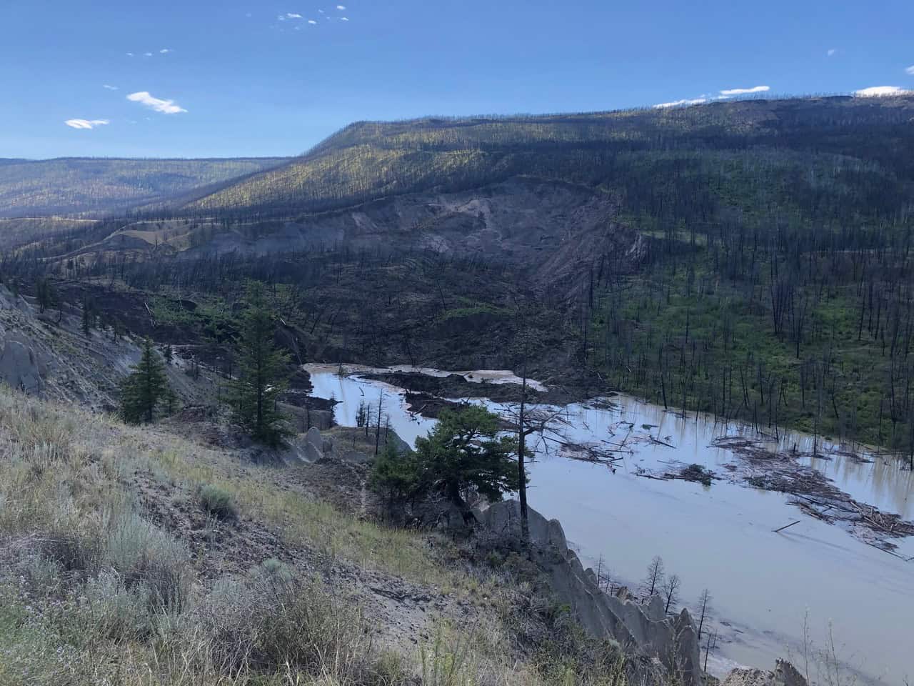 July 30, 2024 Chilcotin Landslide, 12 hours after event – a full-head blockage hillslope to hillslope, approx. 600m across, 30m deep (July 31, 2024).